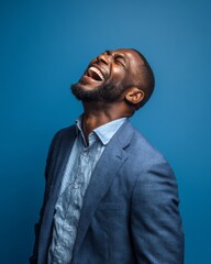 Fototapeta premium Businessman tilting his head back and laughing joyfully, expressing relief and freedom after tension.