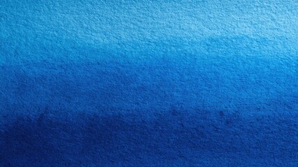 Soft gradients of blue shades create a calming ocean effect on textured paper.