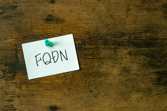 There is a piece of paper with the word FQDN. It is an abbreviation for Fully Qualified Domain Name as eye-catching image.