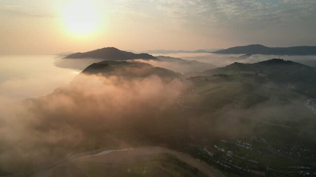 Tripod drone footage of clouds above Zarautz at summer sunrise. Gipuzkoa, Basque Country, Spain.