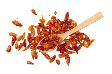 dried bird's eye chili peppers in wooden spoon isolated on white background, top view