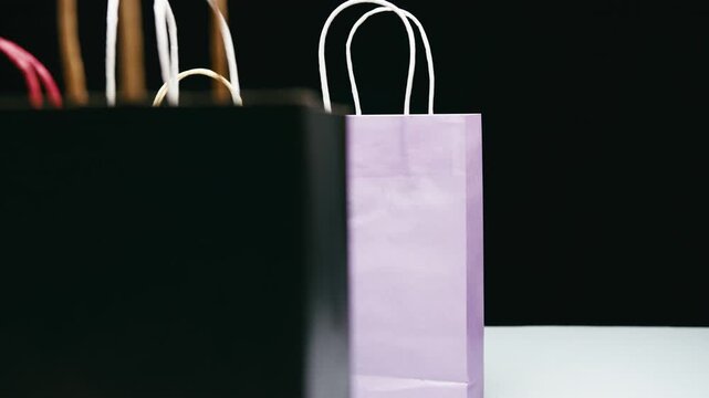 Black Friday gift bags in a store frantically swapped with a black background