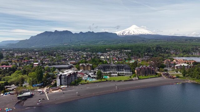 Aerial view of the city of Puc&oacute;n, in southern Chile. The Villarrica Volcano can be seen in the background.