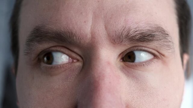 Close up eyes of a man. Eye exercises gymnastics for vision look.