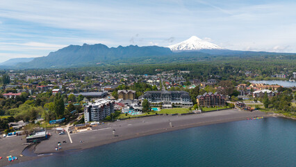 Aerial view of the city of Pucón, in southern Chile. The Villarrica Volcano can be seen in the background.