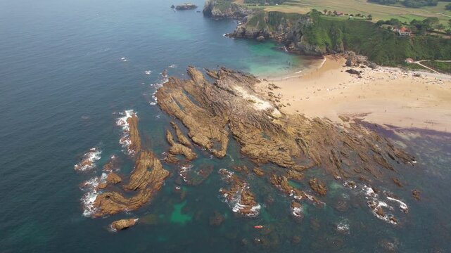 Drone footage of Amio Beach on summer day. Pechon, Cantabria, Spain.