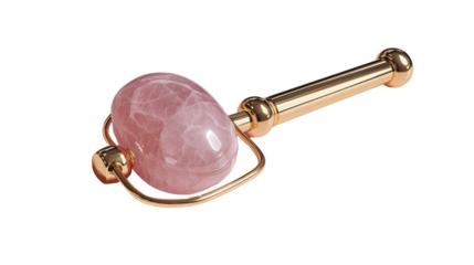 Rose quartz facial roller with gold handle isolated on transparent background