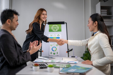 Businesswomen shaking hands after successful esg sustainability partnership deal