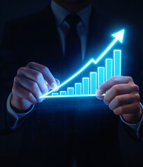 businessman hand drawing rising financial graph for success