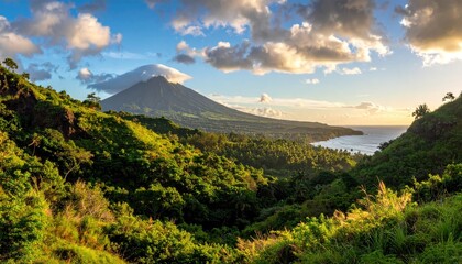 Fototapeta premium Lush Green Tropical Island Mountain Overlooking a Calm Bay at Golden Hour With Dramatic Clouds