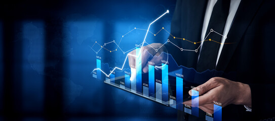 A business professional examines dynamic data trends on a digital tablet, showcasing various graphical representations of growth metrics in a modern corporate setting. Scalp