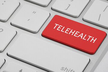 Fototapeta premium Red button with word Telehealth on computer keyboard, closeup