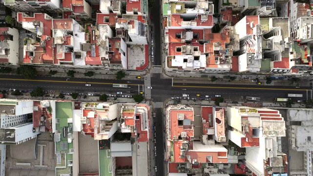 Top-down drone view of Buenos Aires city streets and historical buildings in the urban area of CABA, Argentina.