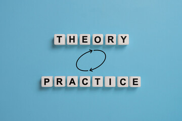 Concept of theory and practice relationship or connection. Dice with the words theory and practice.