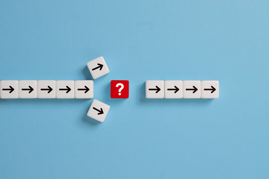 Question mark print screen on red dice cross in the middle of arrow for interrupt of process concept.