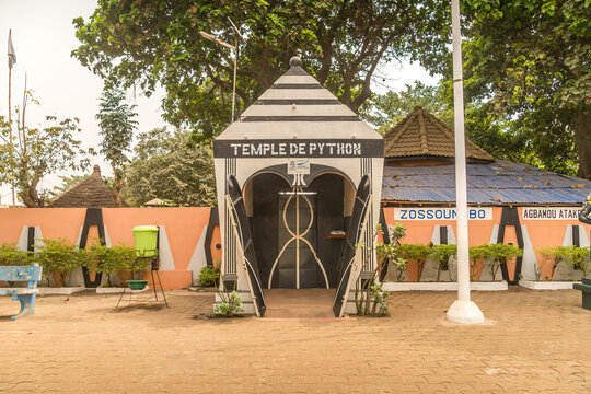 Temple de Python entrance in Ouidah, Benin, sacred Vodun site dedicated to revered pythons, blending local spirituality and cultural heritage.

