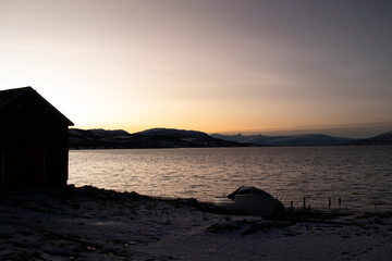 Tromsø Fjord Winter Evening Sunset with Silhouette and Tranquil Arctic Landscape