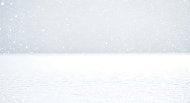 Snow falls gently on a pristine white field, creating a serene and peaceful winter landscape with soft, diffused lighting, evoking a sense of calm and tranquility.