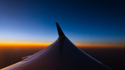 airplane on the sky during sunrise 