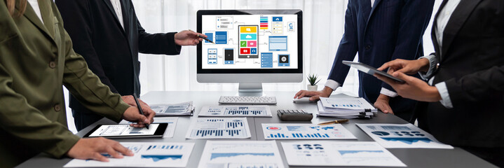 Panorama shot analyst team utilizing BI Fintech to analyze financial report with laptop....