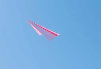 A paper airplane in flight, soaring against a clear blue sky, hobby, design