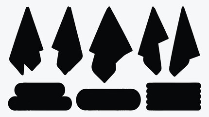 Towels in various styles hanging and stacked black and white design