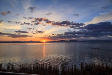 Golden Sunrise Over Calm Waters, Lake Biwa, Japan
