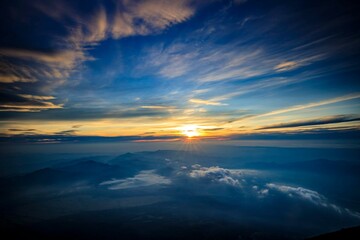 Fototapeta premium Spectacular Sunrise Over a Sea of Clouds from Mount Fuji Summit