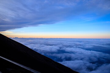 Above the Clouds at Dawn with Soft Blue and Pink Horizon