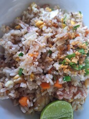 Authentic Thai Fried Rice with Pork Egg and Fresh Lime Garnish