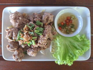 Authentic Thai Fried Pork with Chili Dipping Sauce and Fresh Lettuce