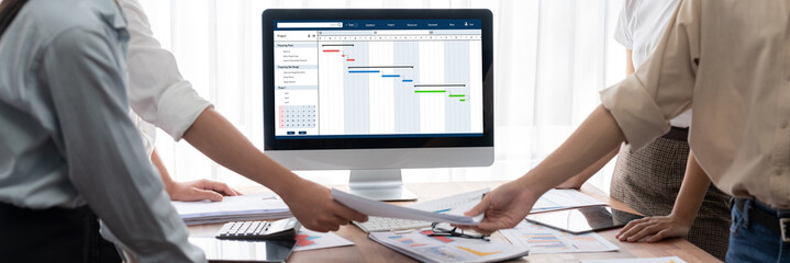 Project planning software for brisk business project management on the computer screen showing...