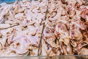 This picture shows that many chicken cuts consist of wings and skeletons in the store