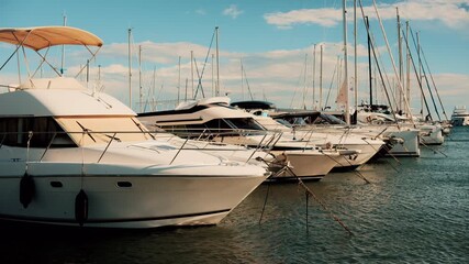 Cannes, France - October 13, 2025: White yachts and sailboats moored in a calm marina