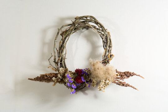 Boho dried flower wreath with fluffy natural accents, grapevine base, wall decor
- Powered by Adobe