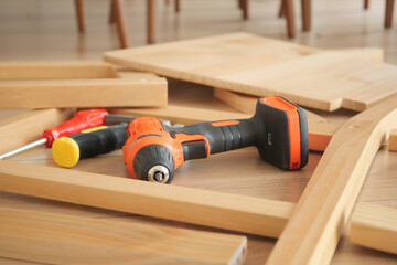 Tools strewn on the floor during assembly