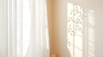 Sunlight filtering through a white curtain casts a beautiful shadow of leaves and a window frame on a beige wall in a tranquil room