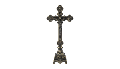 Ornate metal crucifix with jesus figure on a decorative base, standing upright on a white background