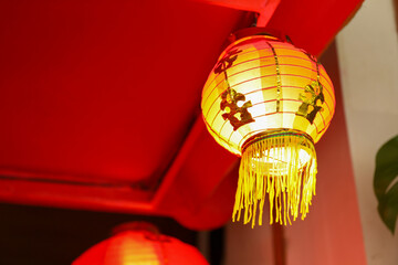 Golden red lanterns illuminate the festive space