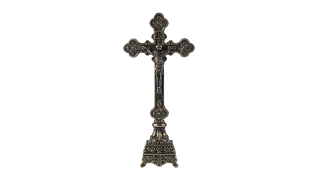 Ornate metal crucifix with jesus figure on a decorative base, standing upright on a white background