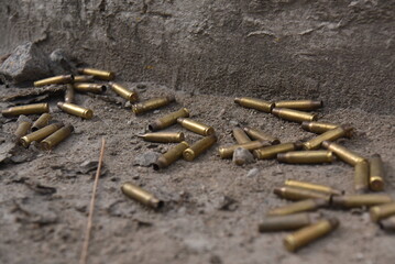 Spent rifle casings on the ground. Concept of violence and crime.