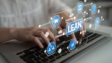 A close-up view of hands typing on a laptop, featuring a digital interface highlighting key components of lean management, focusing on efficiency and employee collaboration. Tessel