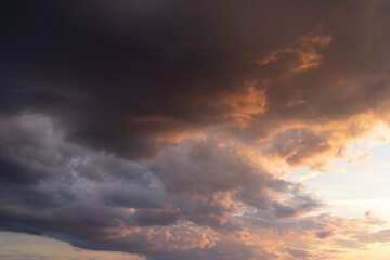 dramatic sky with clouds Displays a dark sky with moody clouds. Full-frame composition, gray-black tone