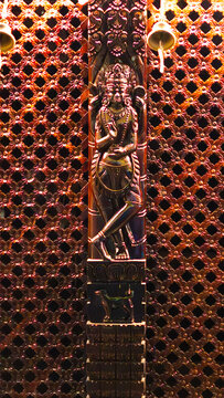 Intricately carved wooden tudal in a traditional Nepalese temple, showcasing rich Newar craftsmanship and ancient architectural detail.