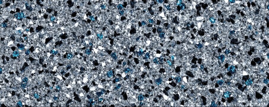 Gray epoxy coating with blue black white chips concept. A shimmering texture with a blend of silver, black, and blue hues.