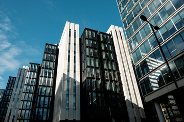 Naklejka premium Modern downtown buildings against clear blue sky