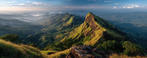 Obraz premium Breathtaking sunrise over green mountains showcasing vibrant colors concept. Stunning mountain view with lush greenery and dramatic lighting.