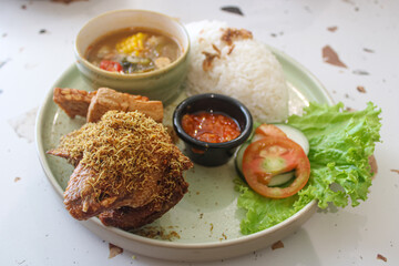 Traditional Indonesian Fried Chicken with Rice and Soup