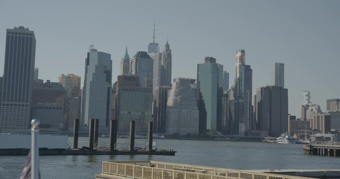 Handheld wide shot of New York city skyscrapers, bay and docks