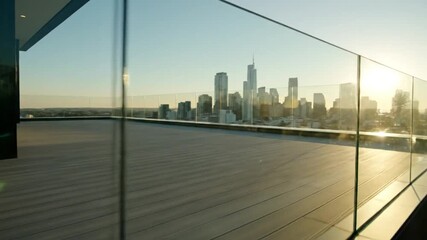 City Skyline View from Modern Rooftop Terrace Architectural Elegance with Glass Railings at Sunset